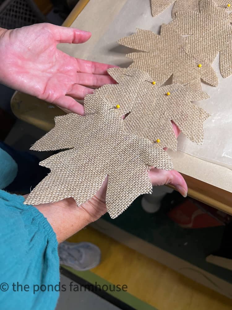 Attached burlap leaves with permanent fabric glue and straight pins