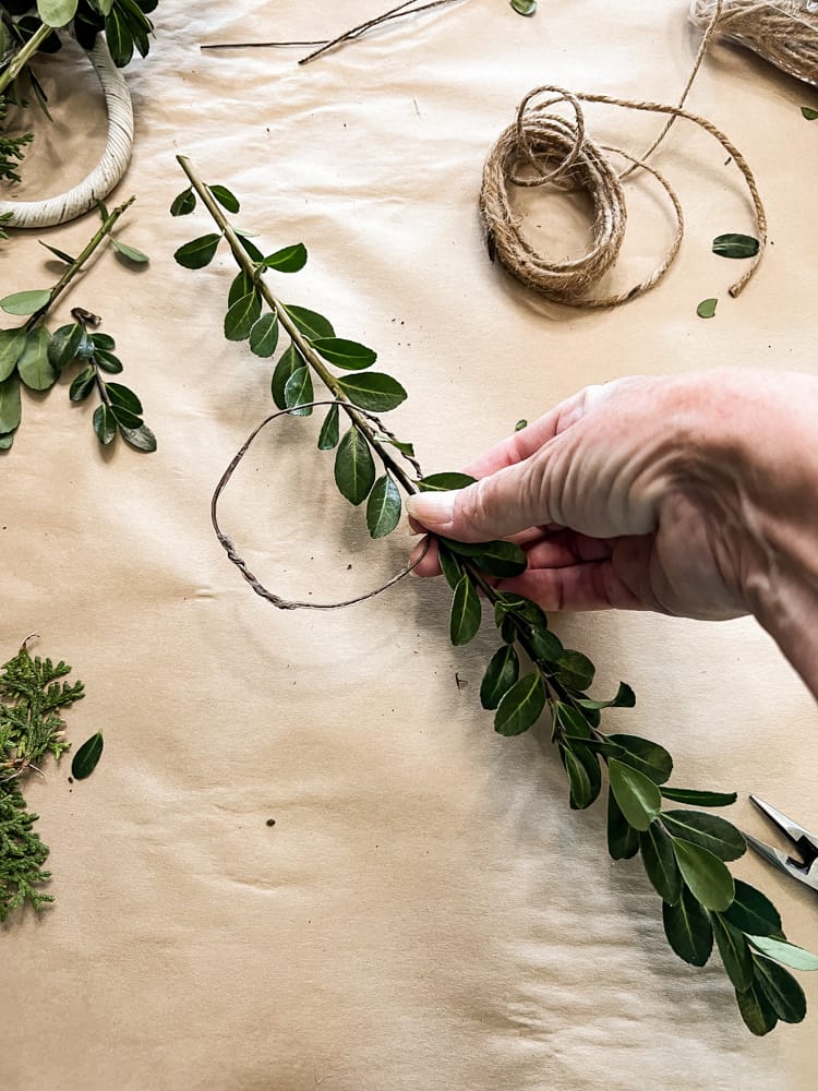 Add Christmas Boxwood to floral wire to make DIY wreath for package toppers.