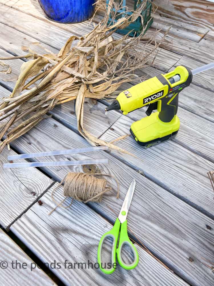 Hot Glue Gun and Corn Stalk Tassels are needed to make a corn husk wreath.  