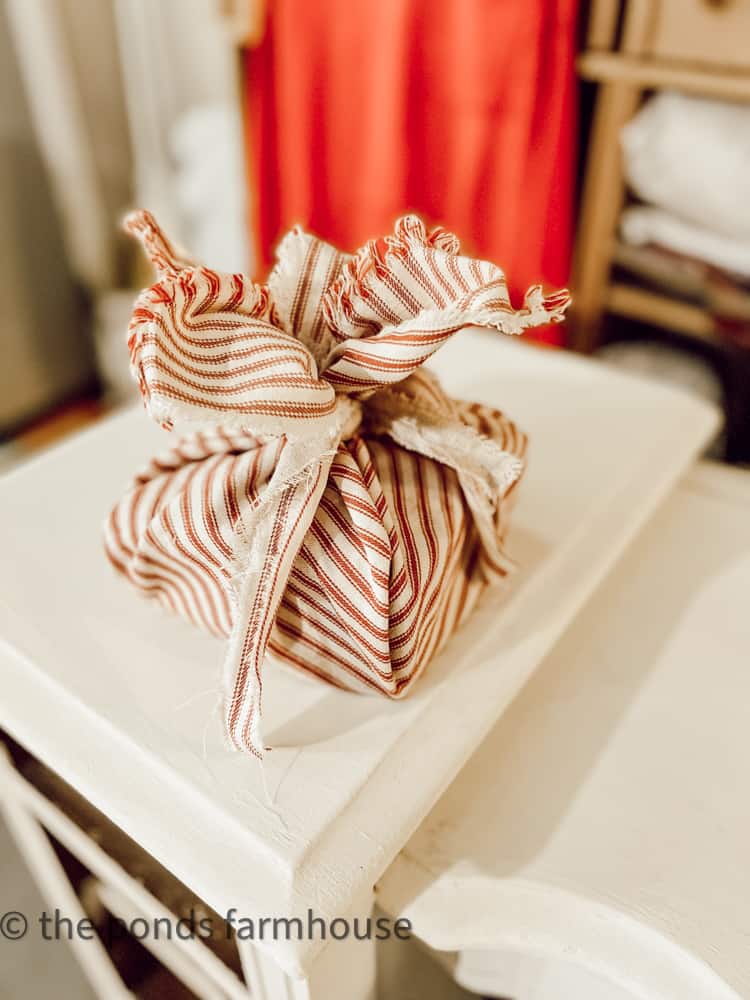 Recycle scrap fabrics for gift wrap, package toppers and ornaments to save money this Christmas. 