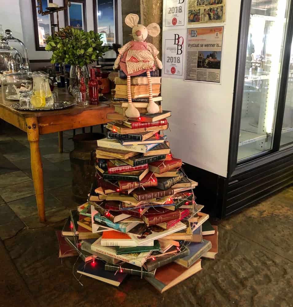 Books stacked like a Christmas Tree for a unique farmhouse Christmas.