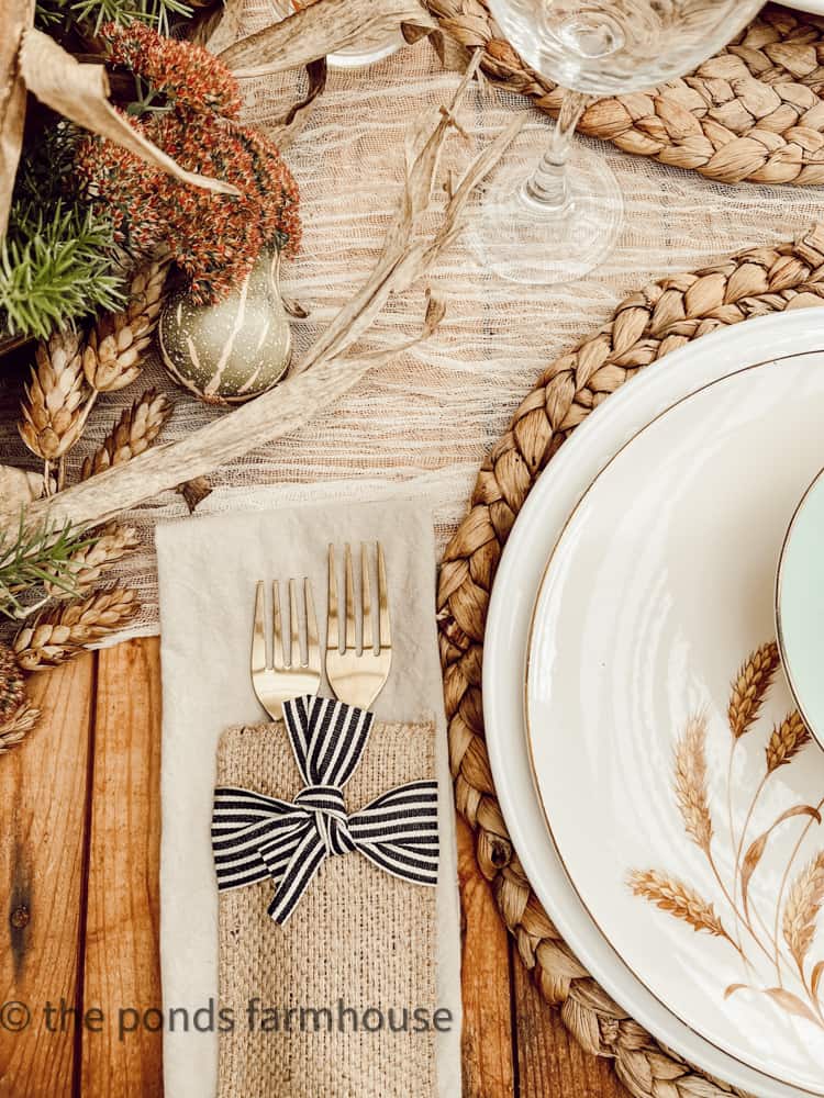 Cutlery Pockets with black and white bow tie with gold silverware on Thanksgiving Table in She She / Greenhouse.