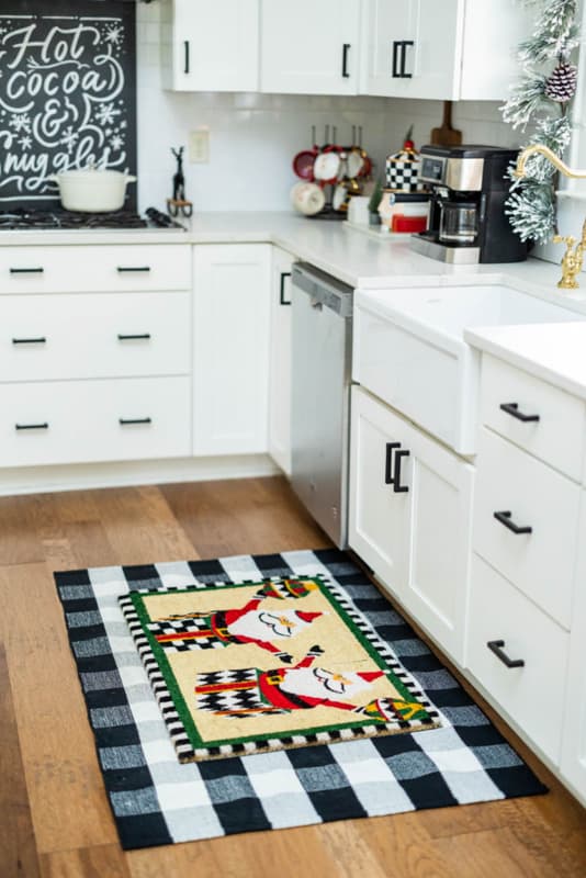 Christmas Kitchen Home Tour with white cabinets and layered Christmas rugs