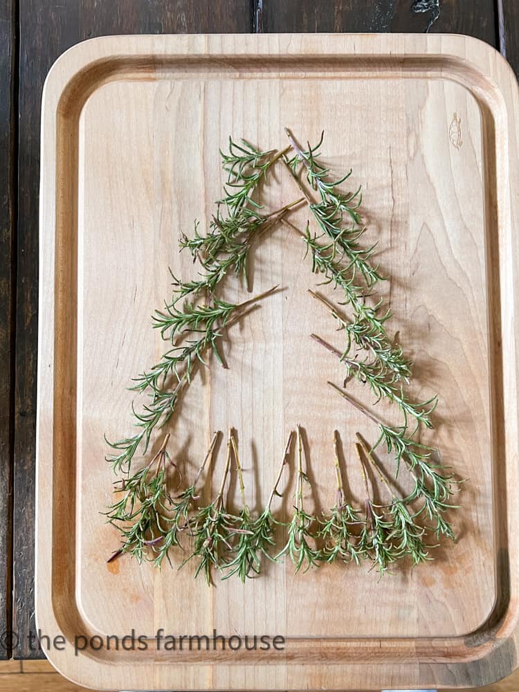 Add fresh rosemary to Charcuterie Board in the shape of a Christmas Tree as a base.