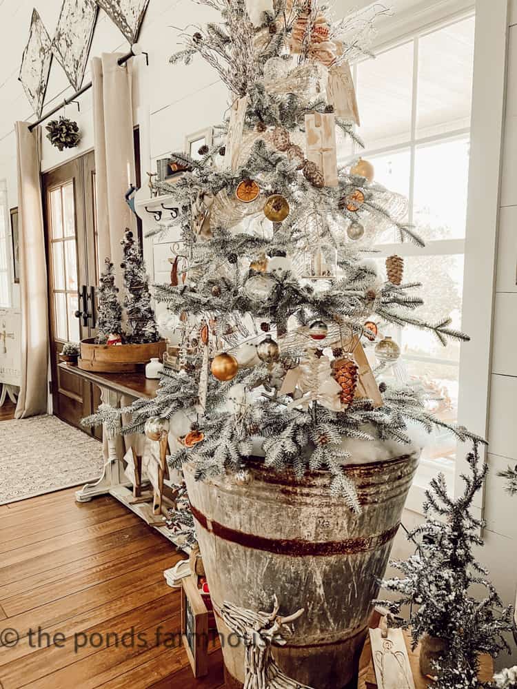 Sustainable Christmas Tree Decorating Ideas with European Antique Olive Hod as tree base.