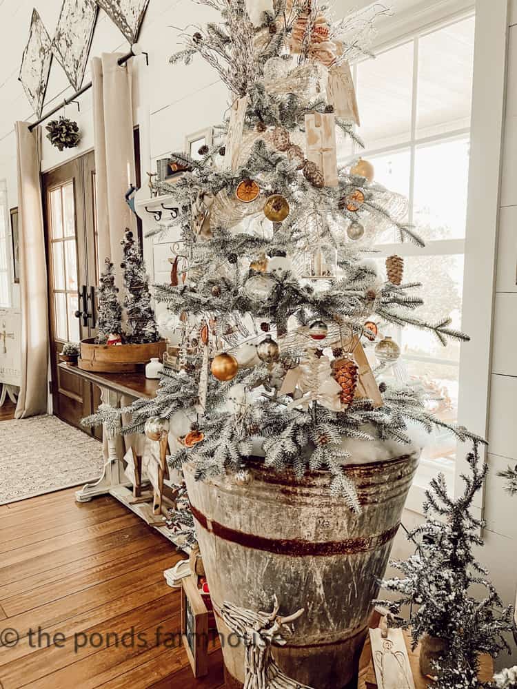 Sustainable ways to decorate Christmas Trees idea with European Antique Olive Hod as tree base.