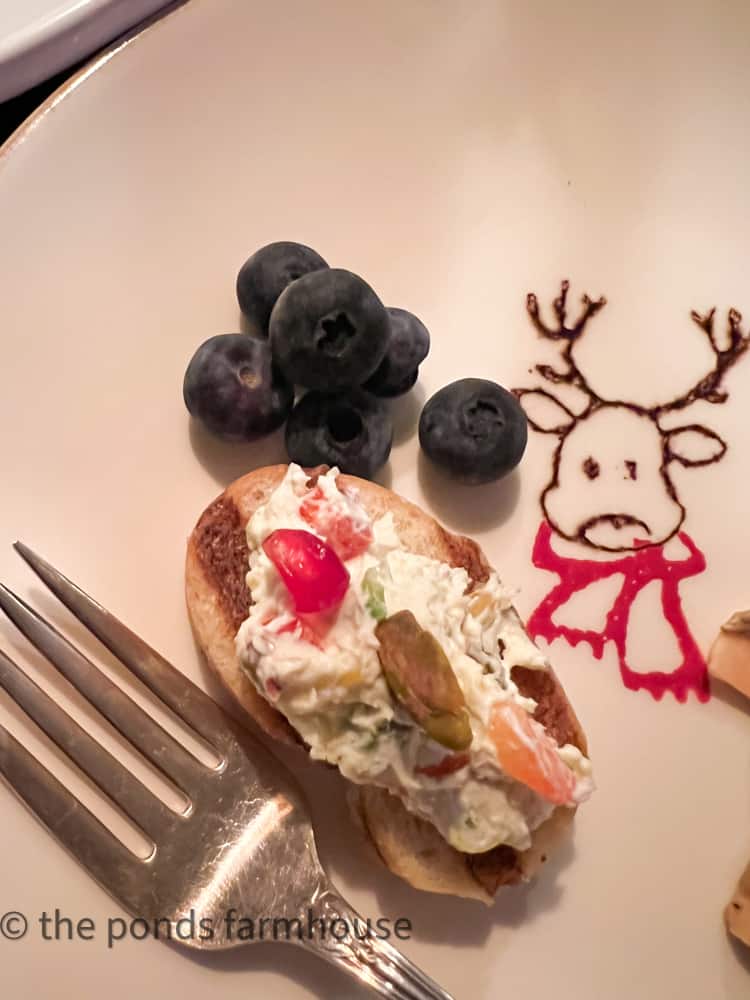 Zesty Pistachio Cream Cheese Veggie Spread for Christmas Entertaining on reindeer plate. Pistachio Recipe