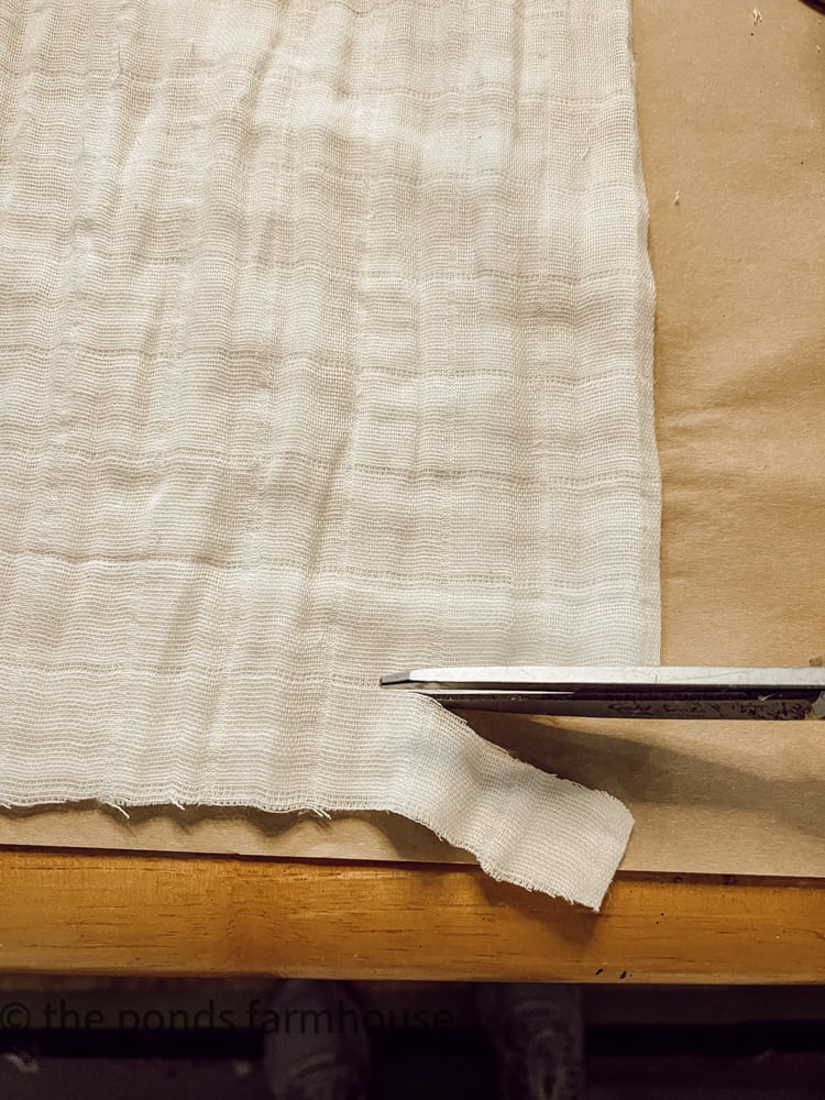 cut white gauze fabric into strips
