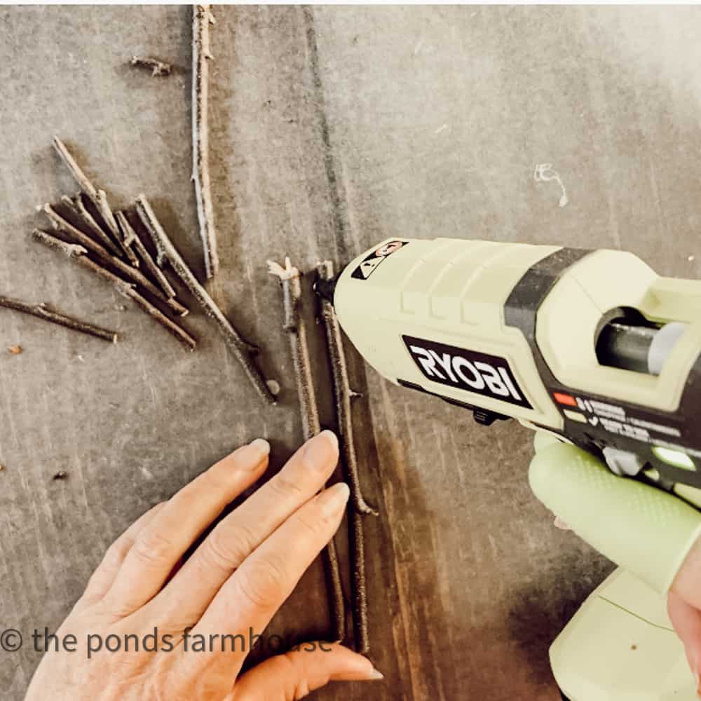 gather foraged twigs to make DIY Christmas Ornaments.