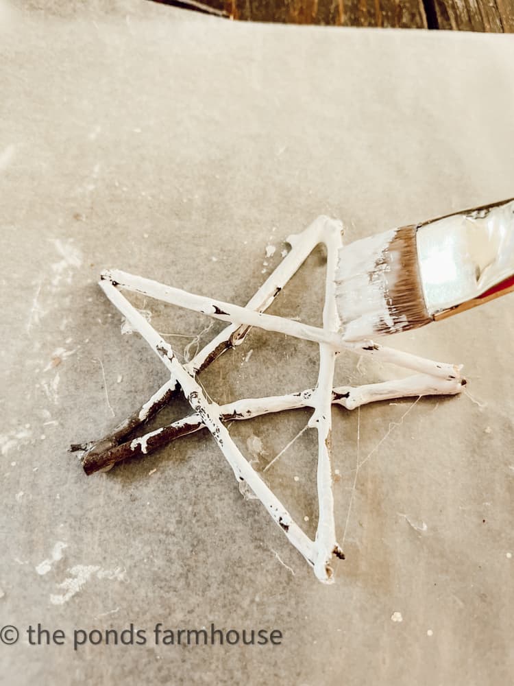 Paint forage twig star ornaments with white chalk paint