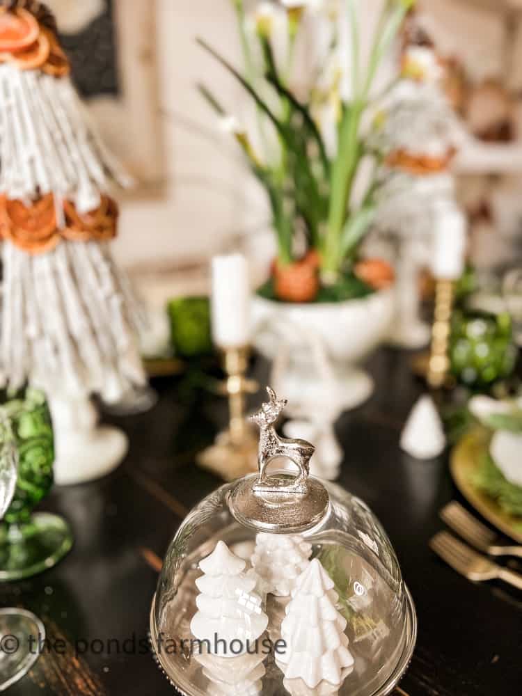 Reindeer mini cake stand with mini white Christmas trees.