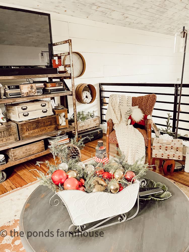 Coffee Table with Christmas Sleigh filled with cedar and vintage shiny brite ornaments