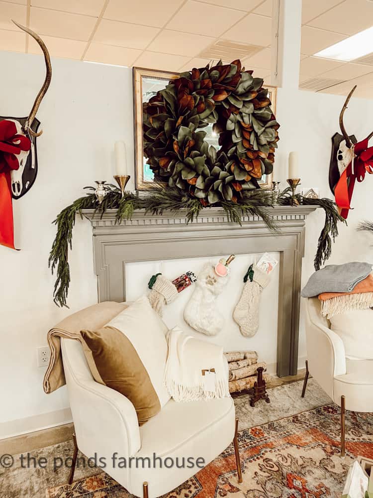 Magnolia Wreath and mantel decorated for Christmas in Retail Shop