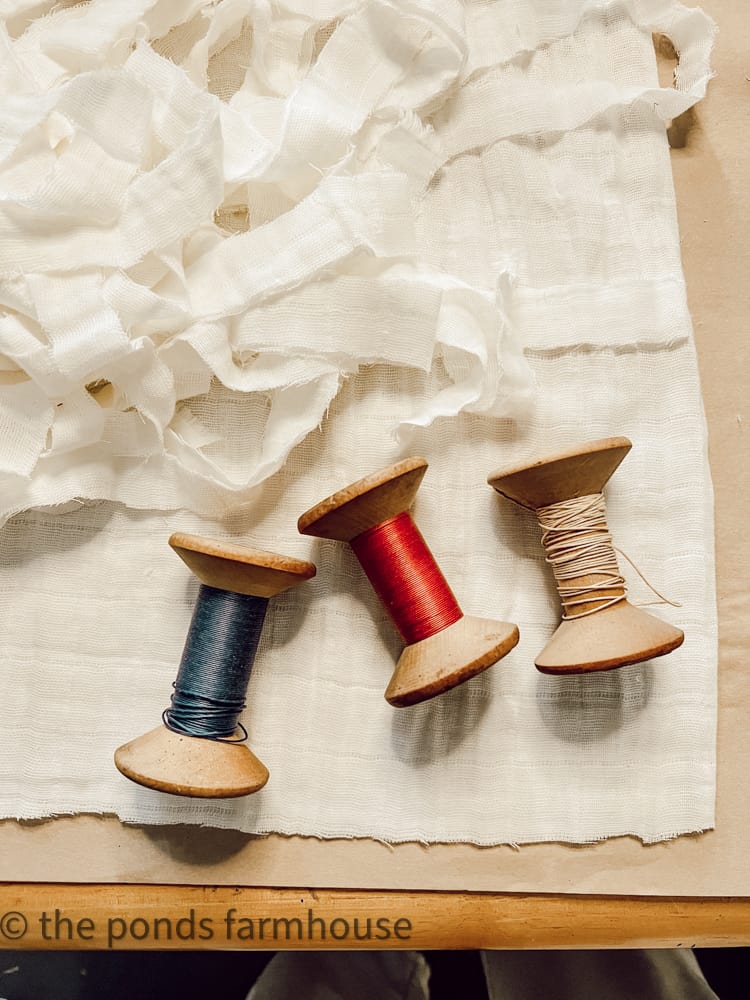 Vintage Wooden Spools and white gauze fabric for Repurposed Wood Spool DIY Tassels.