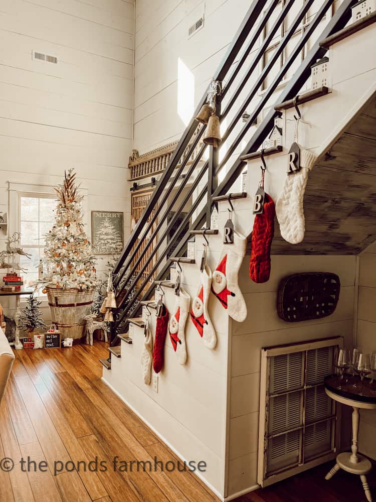 Staircase with Christmas Stockings and Vintage inspired Christmas Tree in Metal Containers