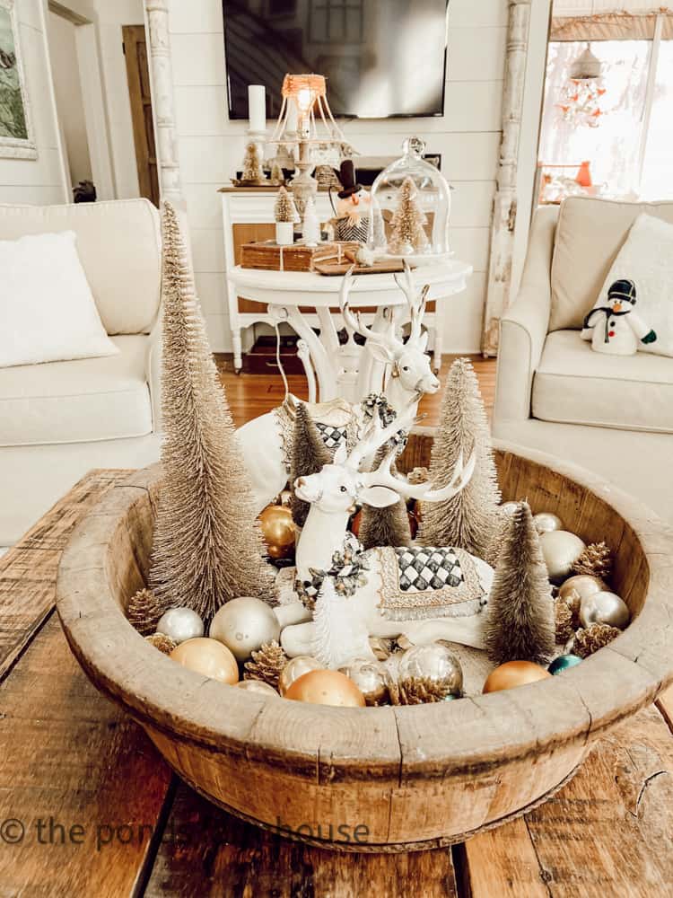 European Wooden Bowl filled with reindeer, bottle brush trees and vintage shiny brite ornaments.