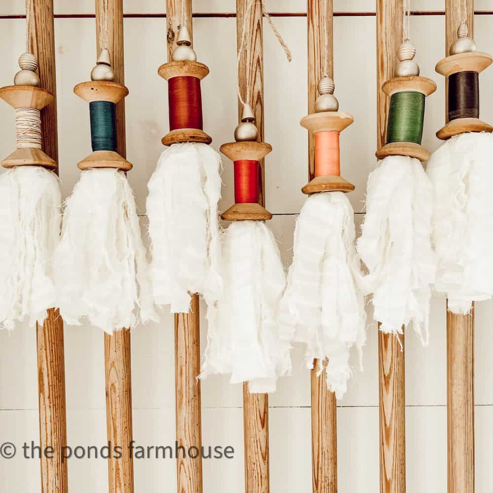Repurposed Wood Spool DIY Project and easy tutorial for a Christmas Garland and holiday decor.