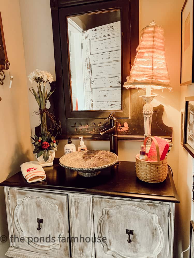 Industrial Style Loft with pottery sink, thrifted vanity and mirror. 