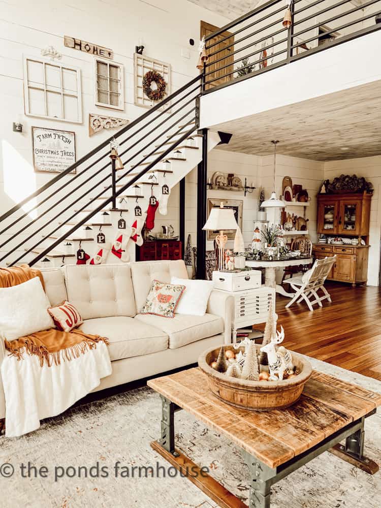Industrial Farmhouse Living Room Christmas Tour. with wrought iron staircase and gallery wall.