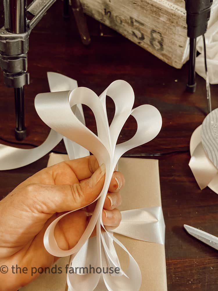 How to make a gift bow for Christmas packages, baby  and bridal shower gifts, birthday packages and more.