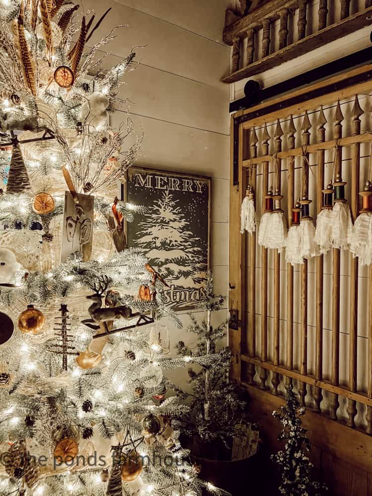 Christmas Candlelight Tour with vintage barn door and DIY Wooden Spool Tassels.  Christmas Tree