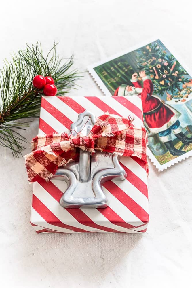 Use items around the house as package topper for creative Christmas Gift wrapping ideas. 