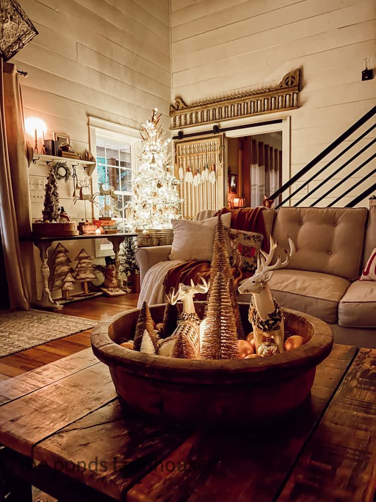 Wooden Vintage Bowl with reindeer and bottle brush trees for Christmas Candlelight Tour.