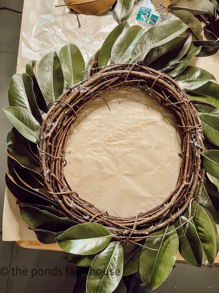 DIY Christmas Wreath made with fresh magnolia leaves for Farmhouse Style Christmas Decor.