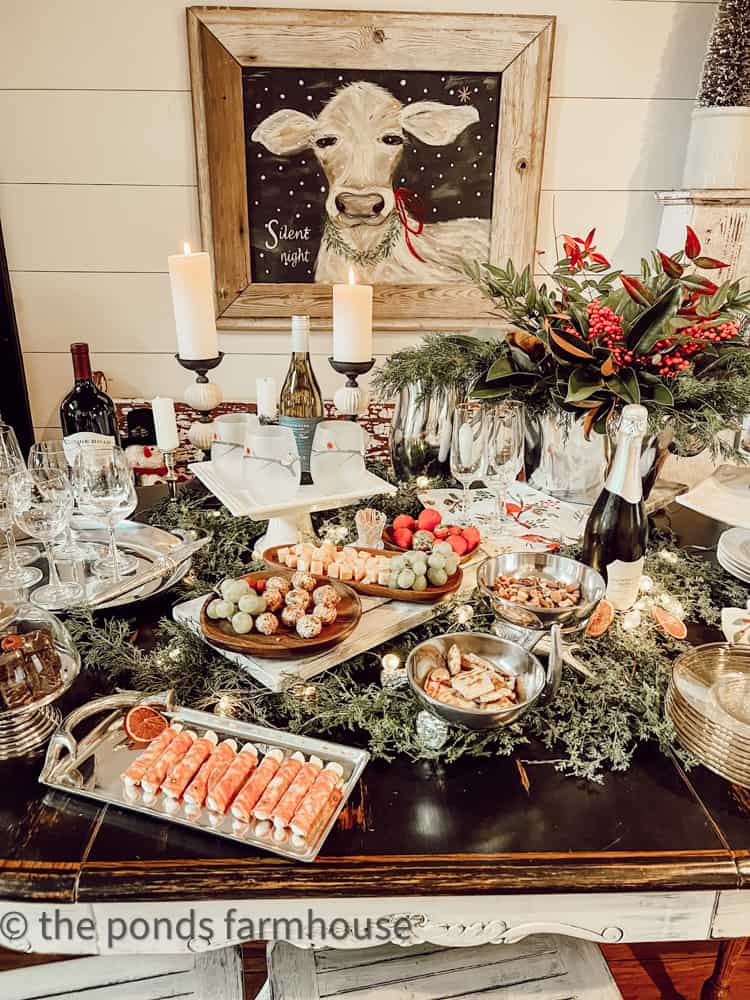 How to Host A Wine Tasting Party  - Table filled with appetizers, wine and wine glasses