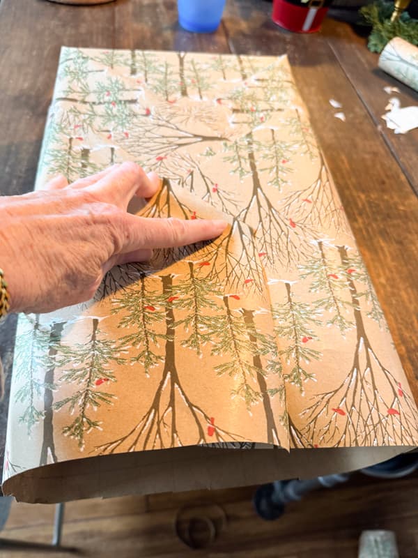 wrap both bottom triangles over the top of the package