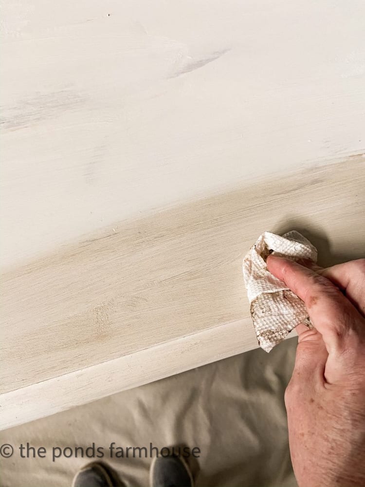 Use a mix of clear and dark wax on white chalk paint to distress the finish.