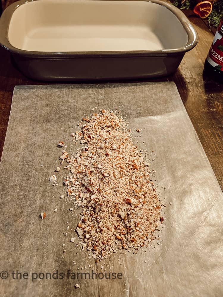 Chopped Pecans on wax paper to roll cheese balls