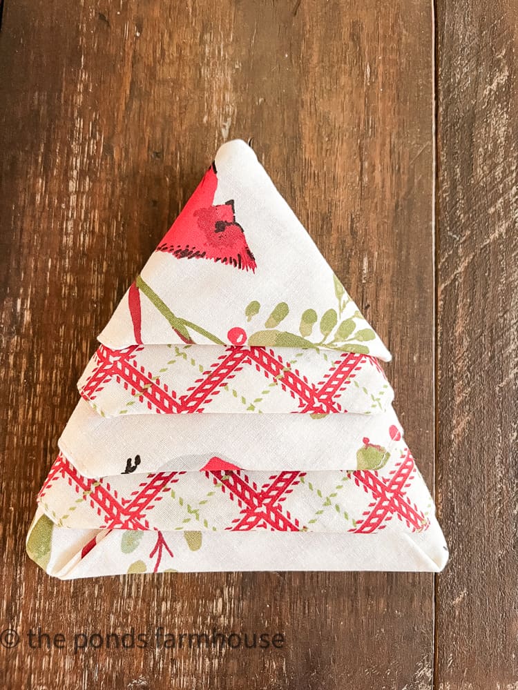How to make a Christmas Tree Napkin Fold for festive holiday table setting ideas.