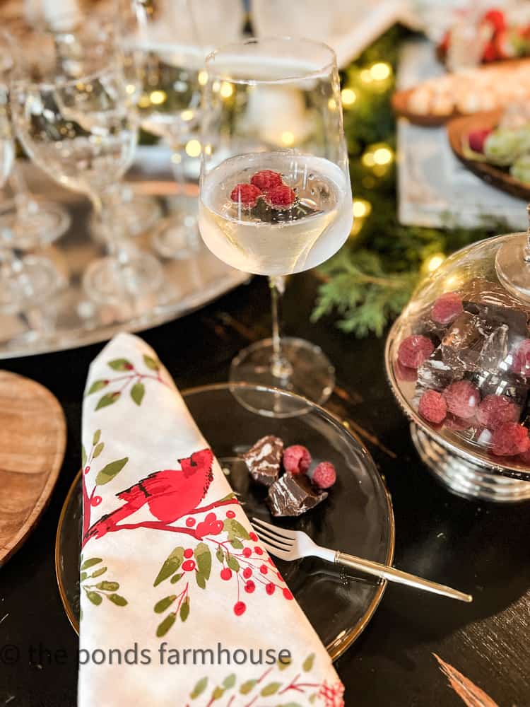 Wine glass and red bird napkins with fudge