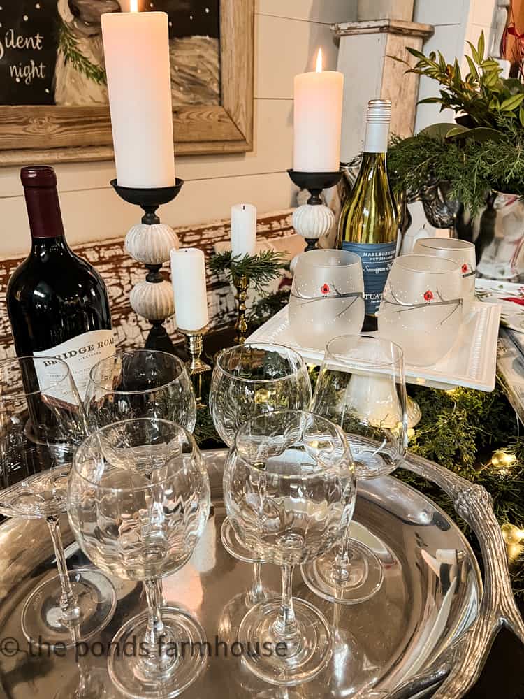 Wine glasses on antler tray set for a home wine-tasting party.  