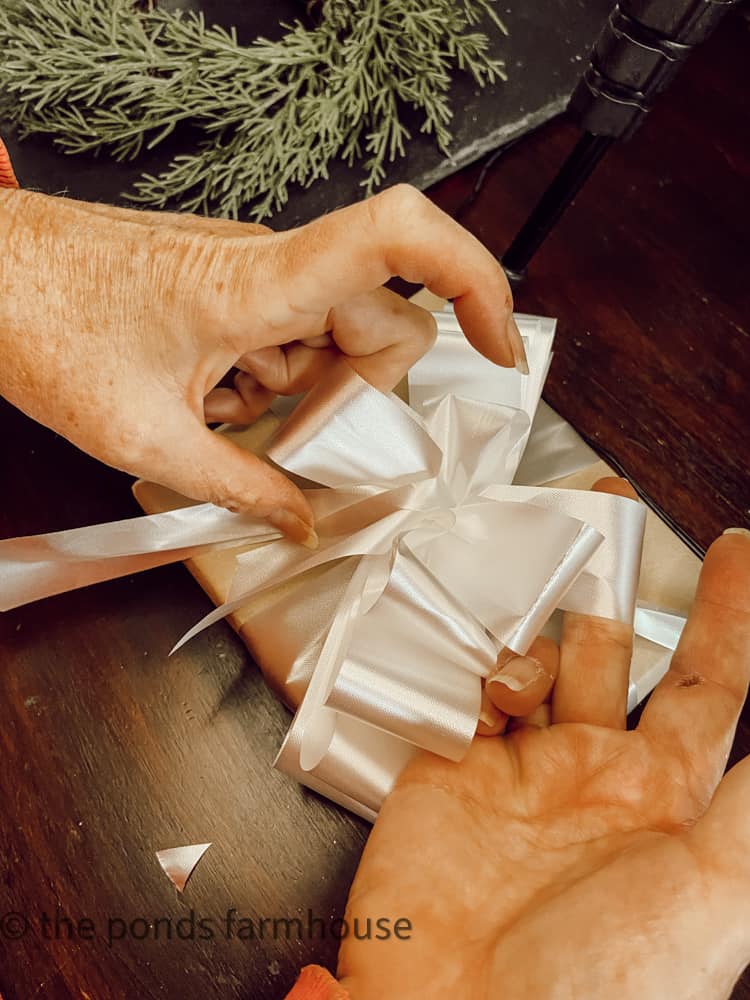 Tips for tying a perfect gift package bow.