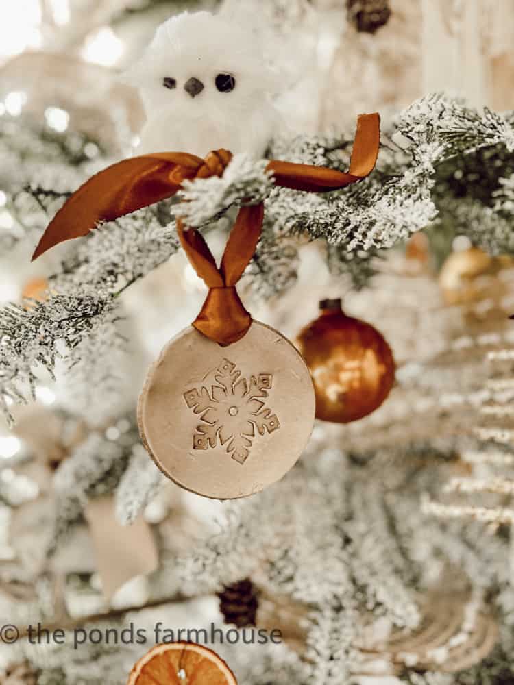 Dry Clay DIY Christmas decoration. Snow bird on Chridstmas tree.