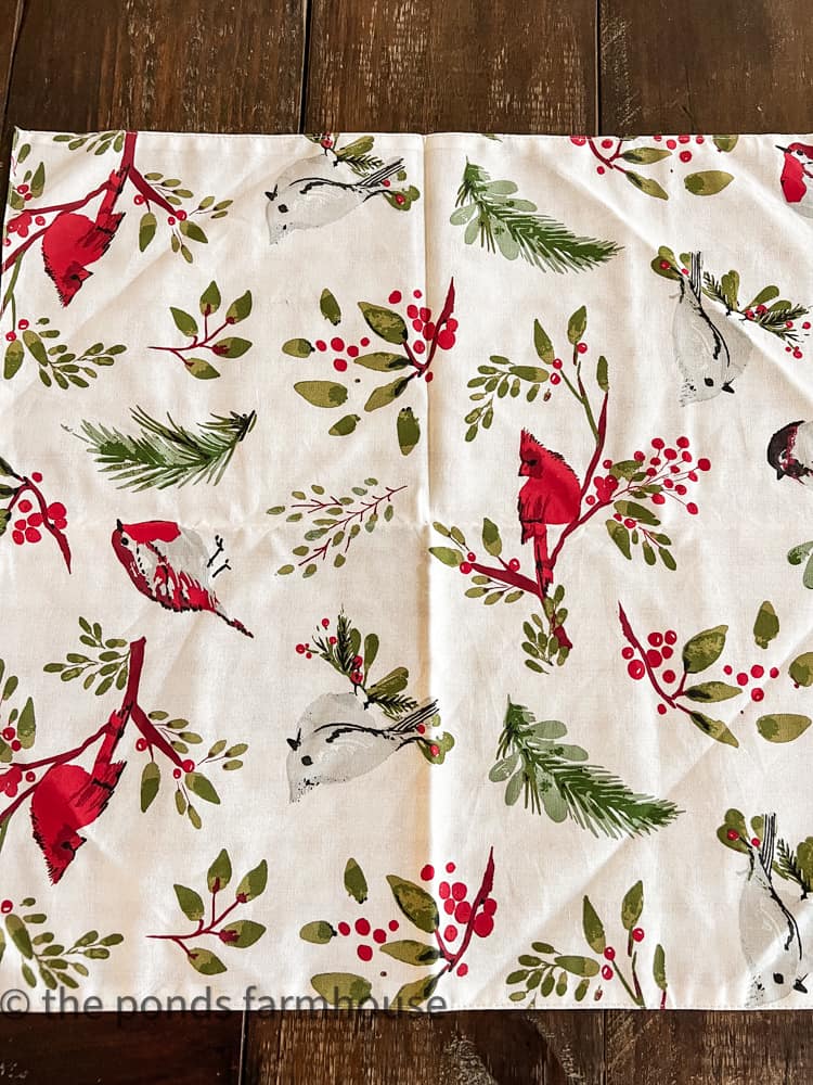 20 inches square red bird napkin with reversible print.