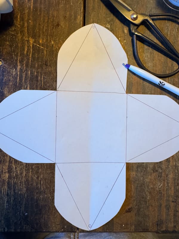 draw fold lines on all four sections of the paper