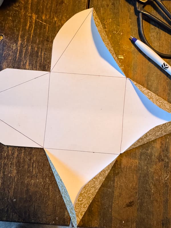 fold along the fold lines to create a triangle gift package.
