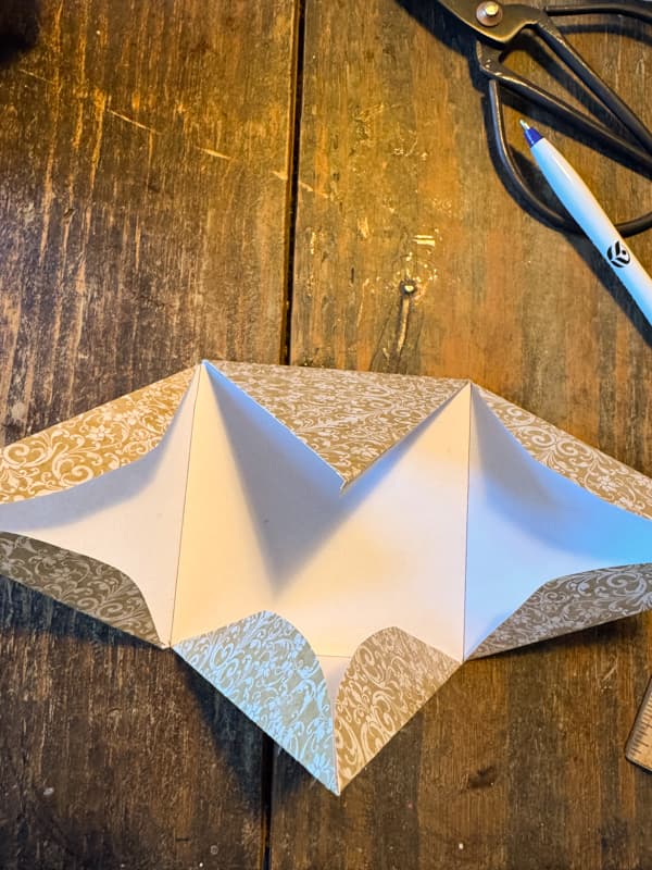 triangle gift package with all edges folded.