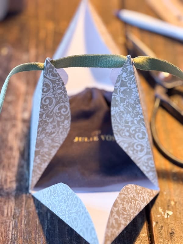 triangle gift package with green velvet ribbon