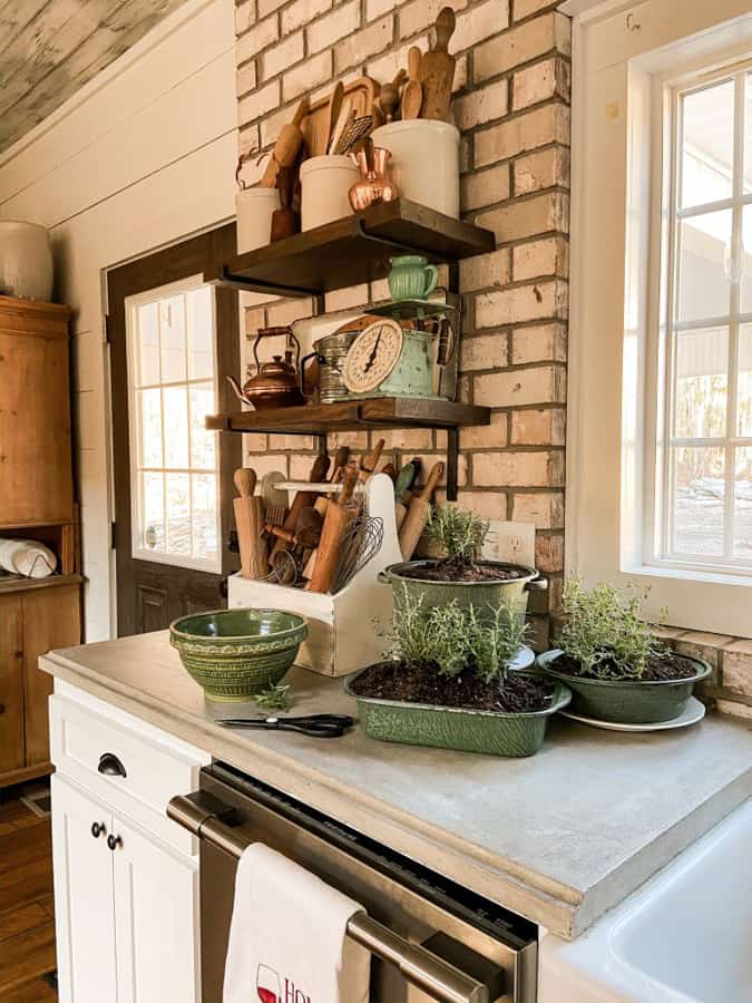 Farmhouse Kitchen Indoor herb garden using vintage enamelware pans