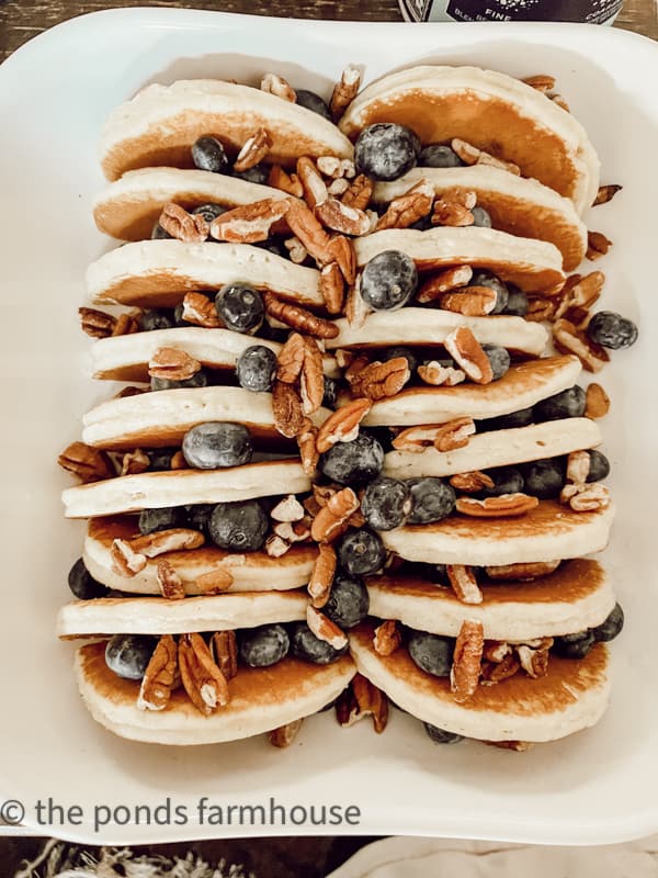 distribute blueberries and pecans evenly between the frozen pancakes.