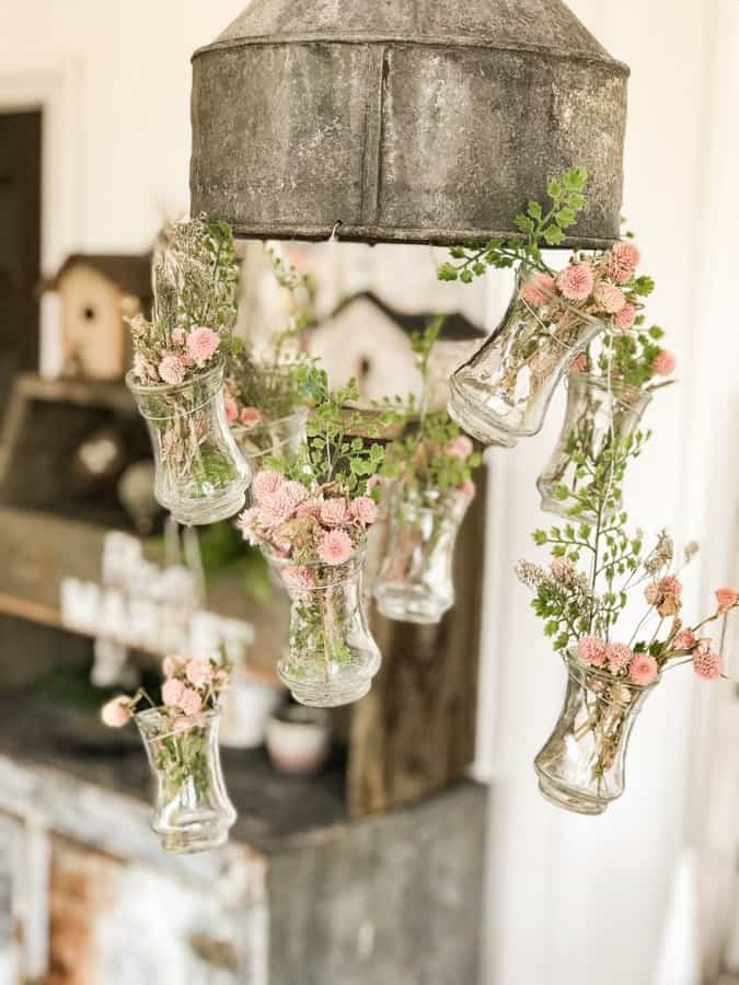 Repurposed & upcycled tractor funnel with thrift store vases.