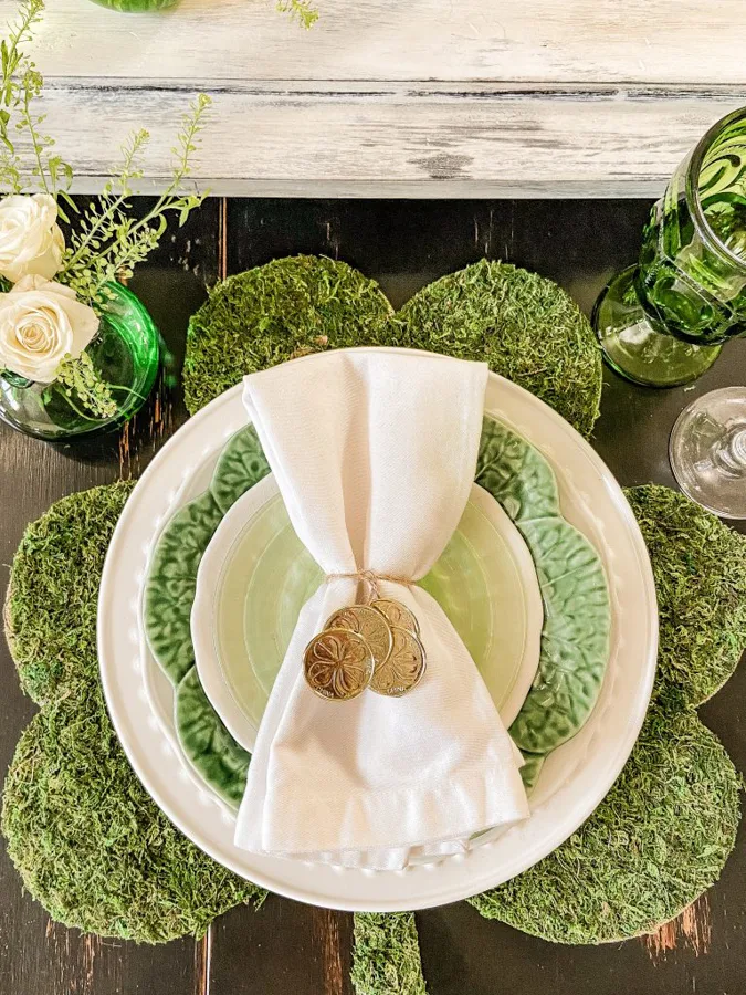 Place setting for St.Patrick Tablescape with gold coins and shamrock placemat from Dollar tree