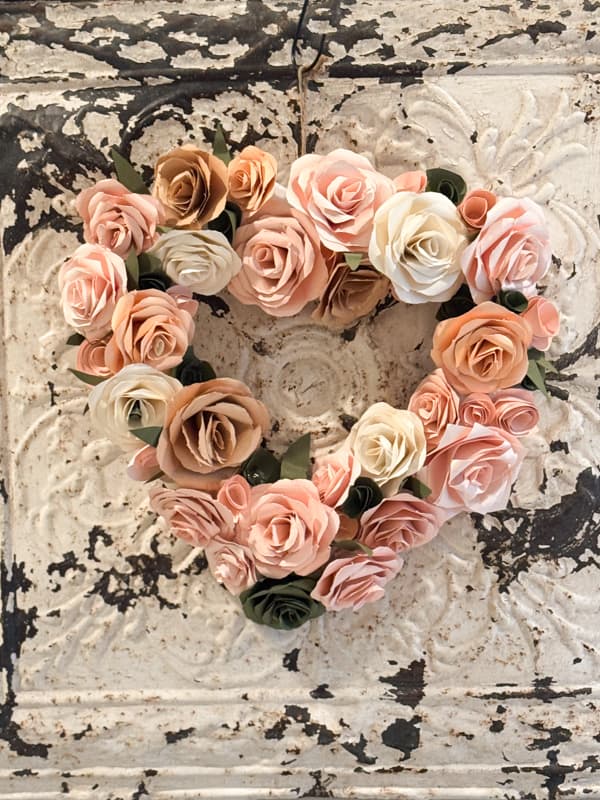 DIY Heart Wreath made with Paper Roses on old ceiling tin.