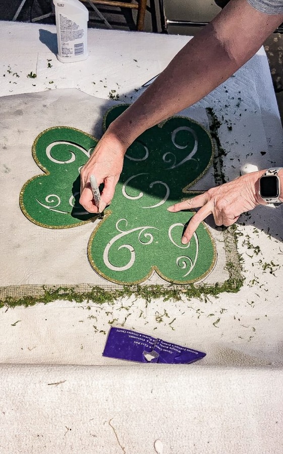 Trace the dollar tree store shamrock onto moss sheet.