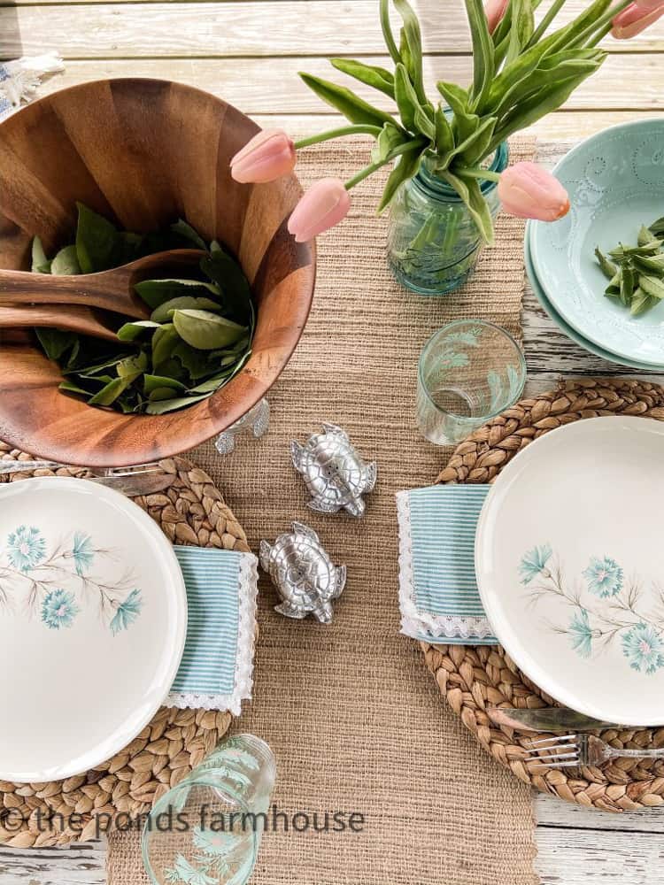 Vintage Yard Sale Dishes make a perfect table setting with aqua and white alfresco dining table setting.