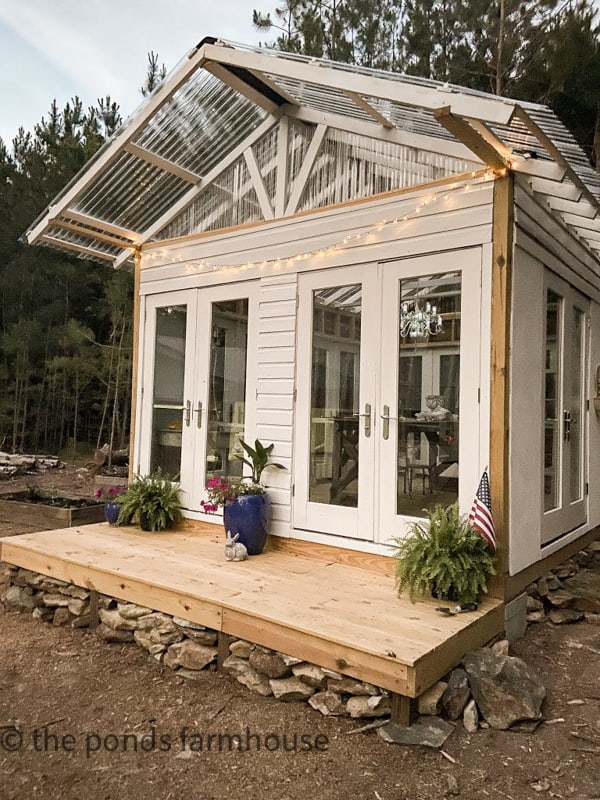 DIY Greenhouse with reclaimed old french doors 